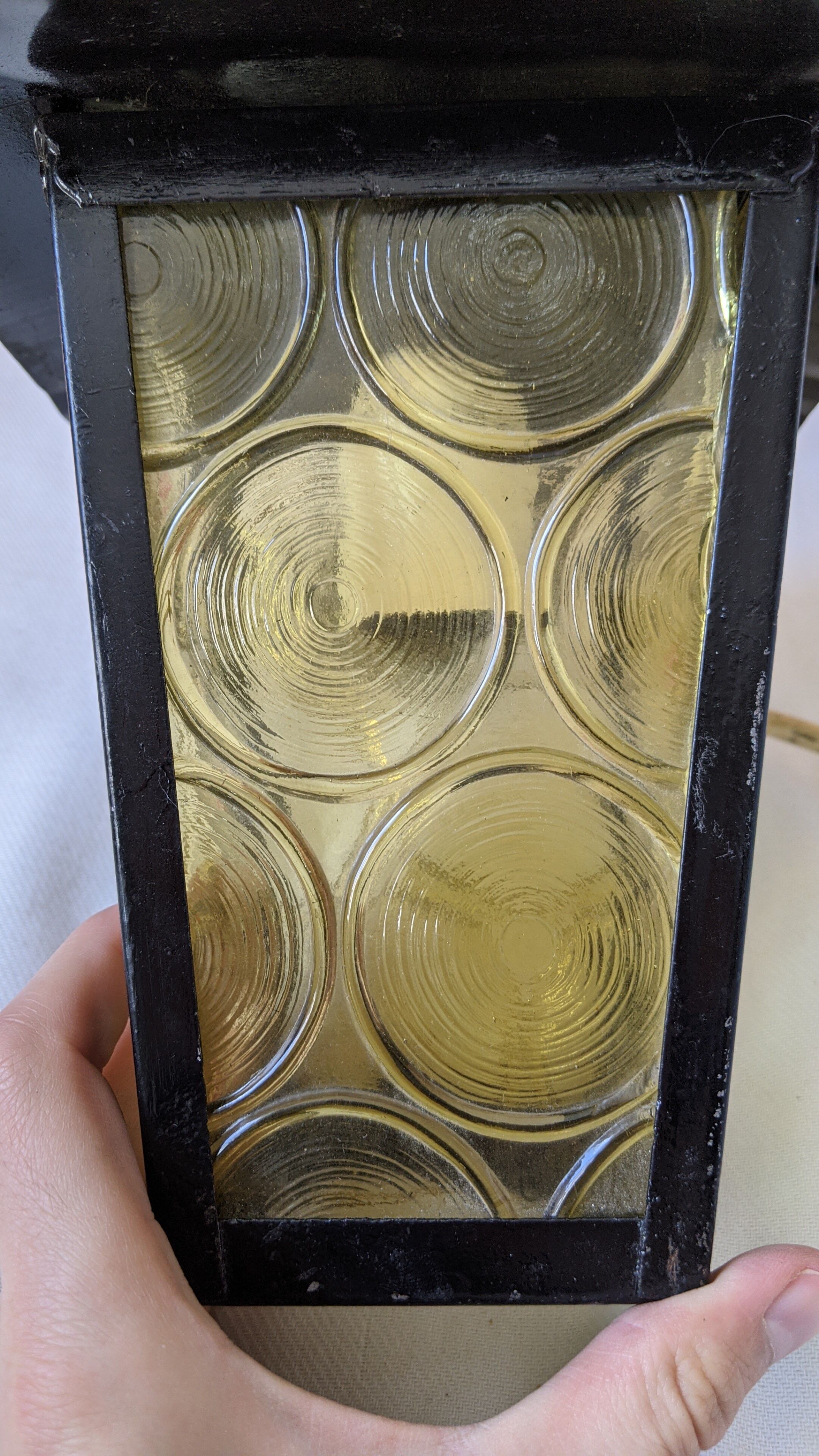 Pretty iron and glass lantern In very good condition black iron color of yellow glass relief circ