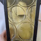 Pretty iron and glass lantern In very good condition black iron color of yellow glass relief circ