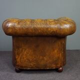 Patinated Chesterfield armchair