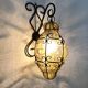 Vintage Italian wall light in transparent yellow blown glass and wrought iron. 70s 80s