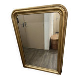 Antique gilded mirror in old Louis Philippe wood