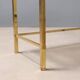 Nested tables in brass and smoked glass.