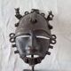 African bronze mask on pedestal, from Ivory Coast, dating