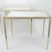 A pair of brass and white mirror tables from Vereinigte Werkstätten, Germany, 1970s.
