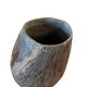 Vintage stone vase with worked fossil