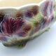 Saint Clement slurry planter with iris decoration.