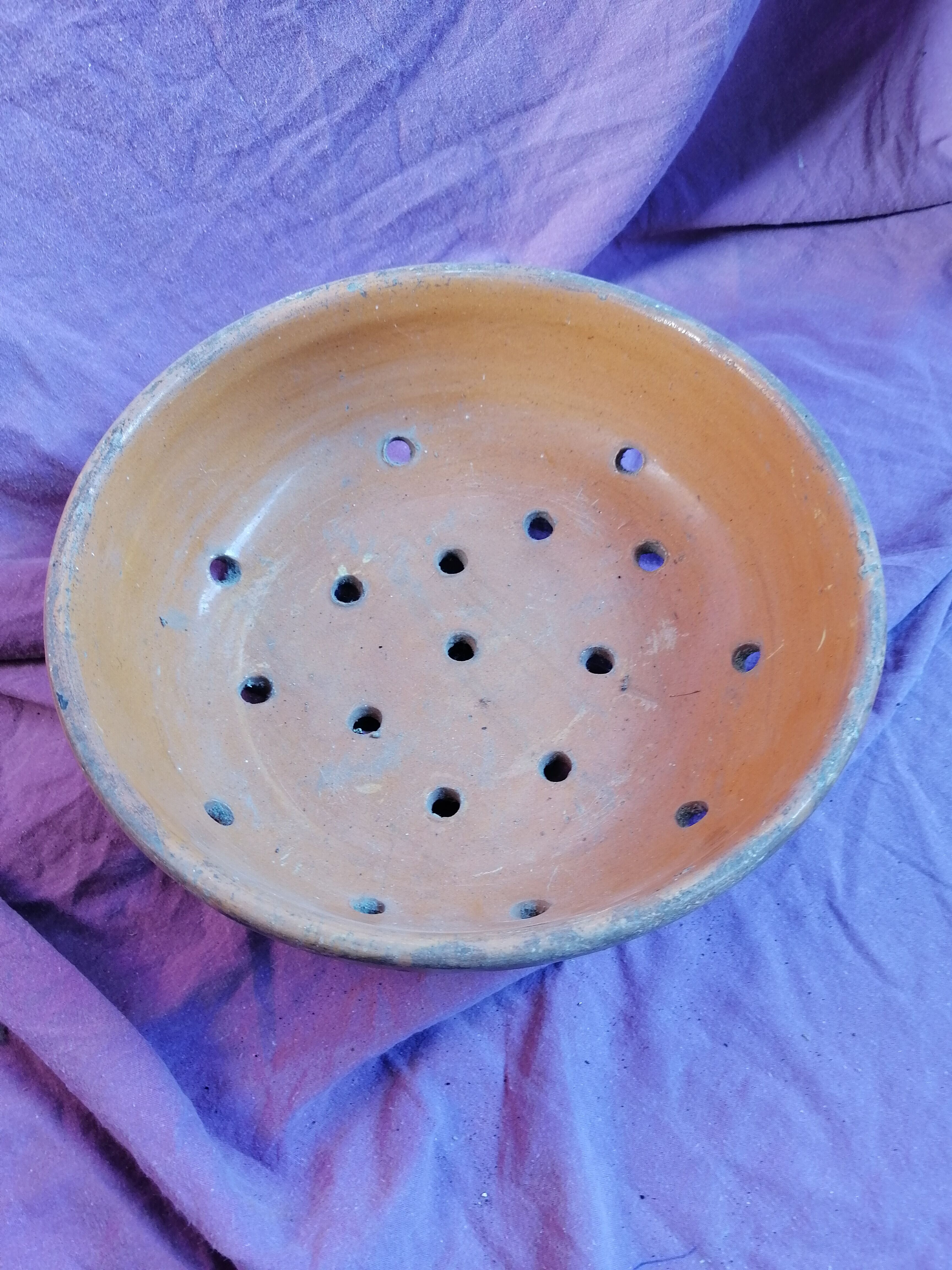 Old dish drainer in mud