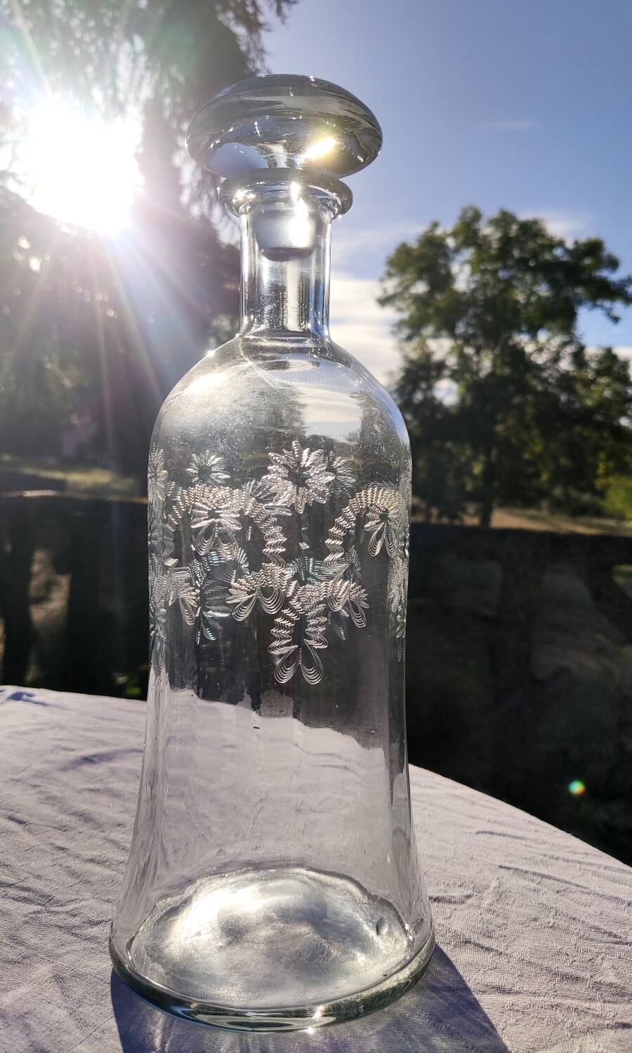 Two antique engraved glass bottles
