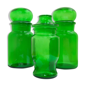 Trio of green glass apothecary jars