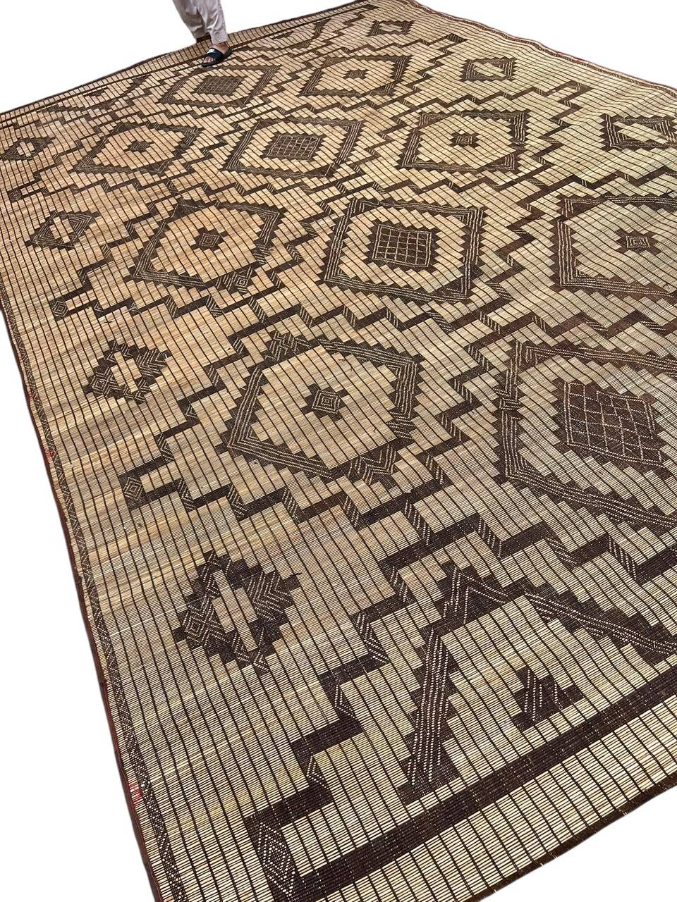 Vintage Touareg mat made of leather and reeds.