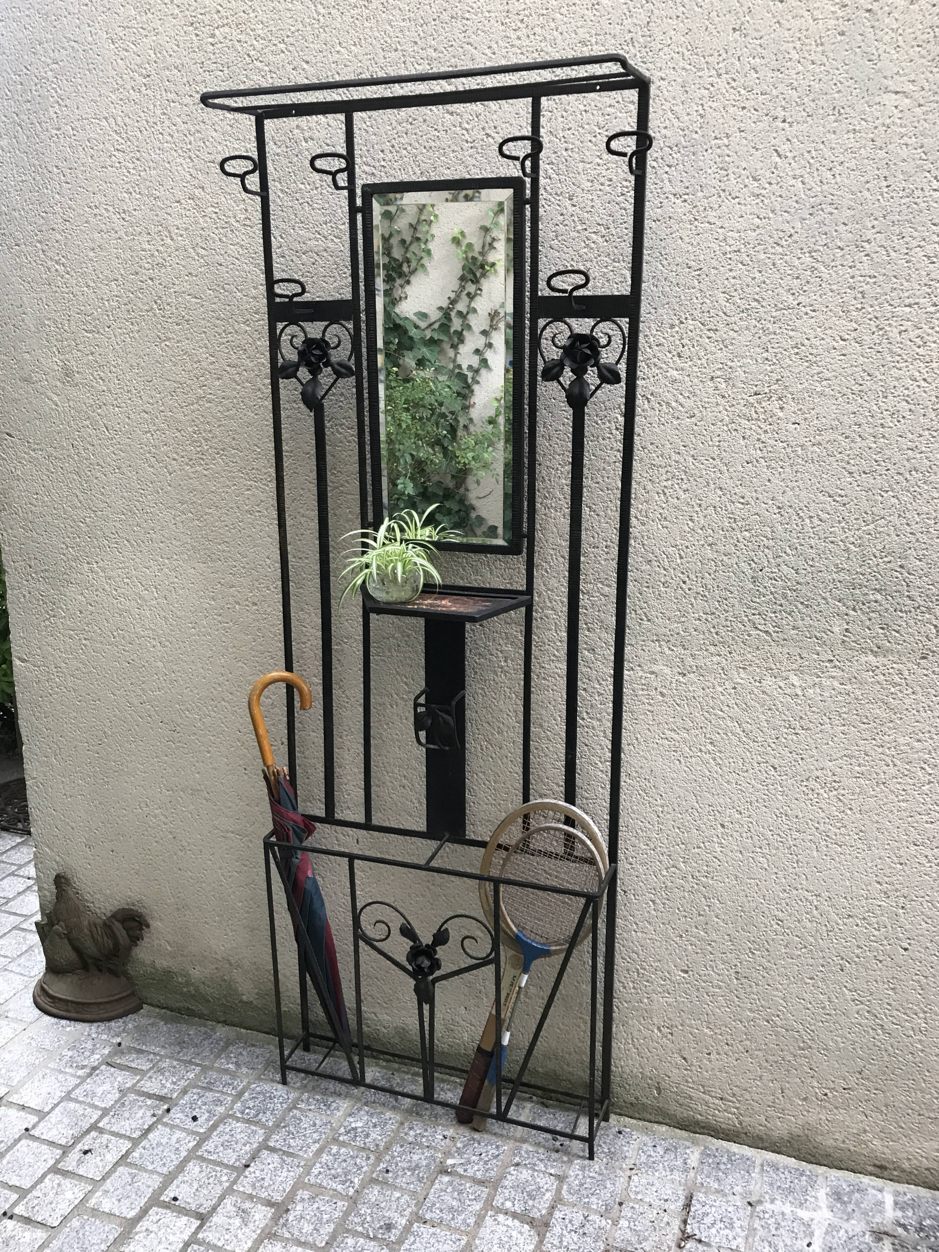 Wrought iron coat holder with 1930