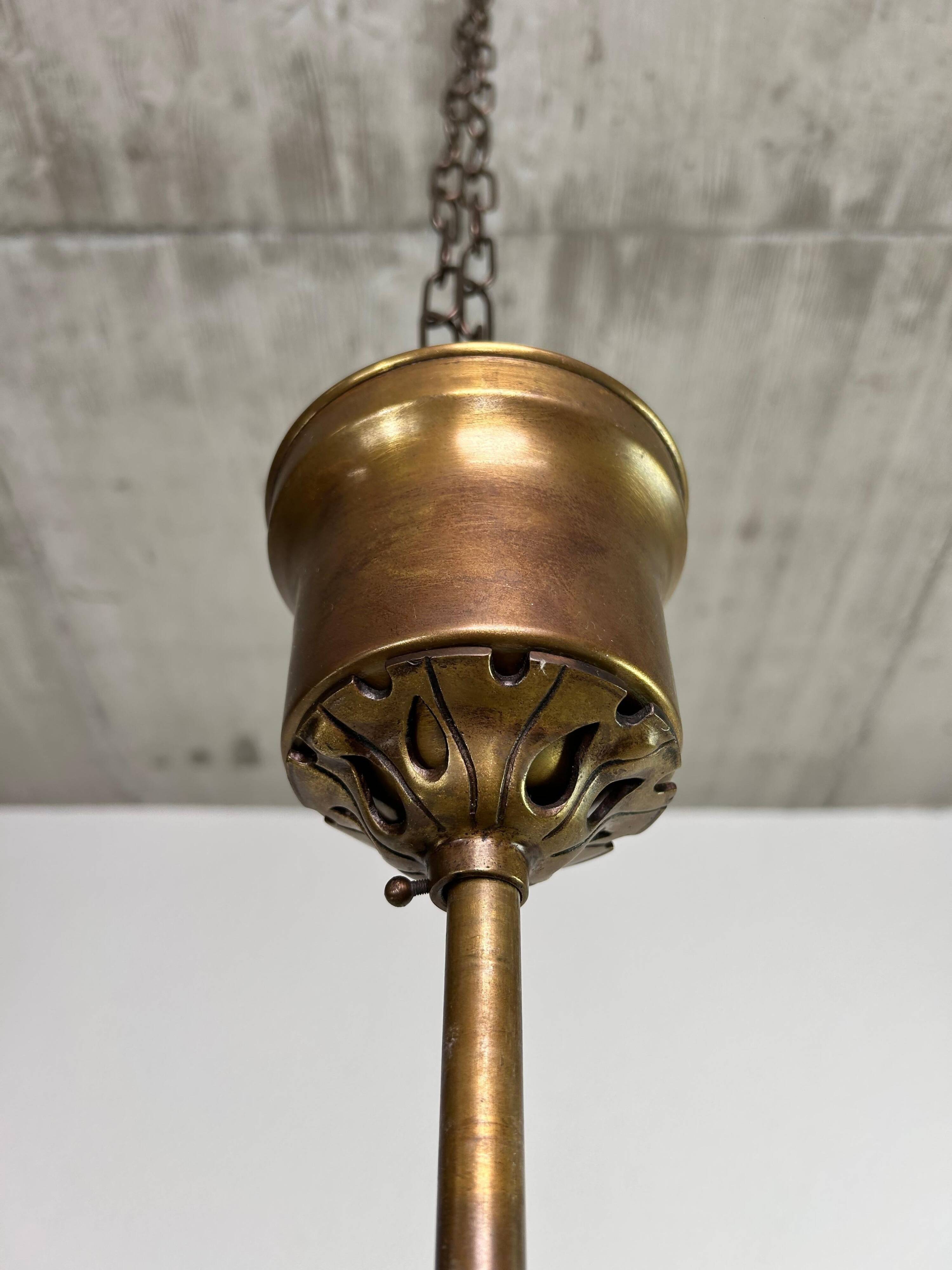 Art Nouveau chandelier with three arms and opalescent iridescent glass.
