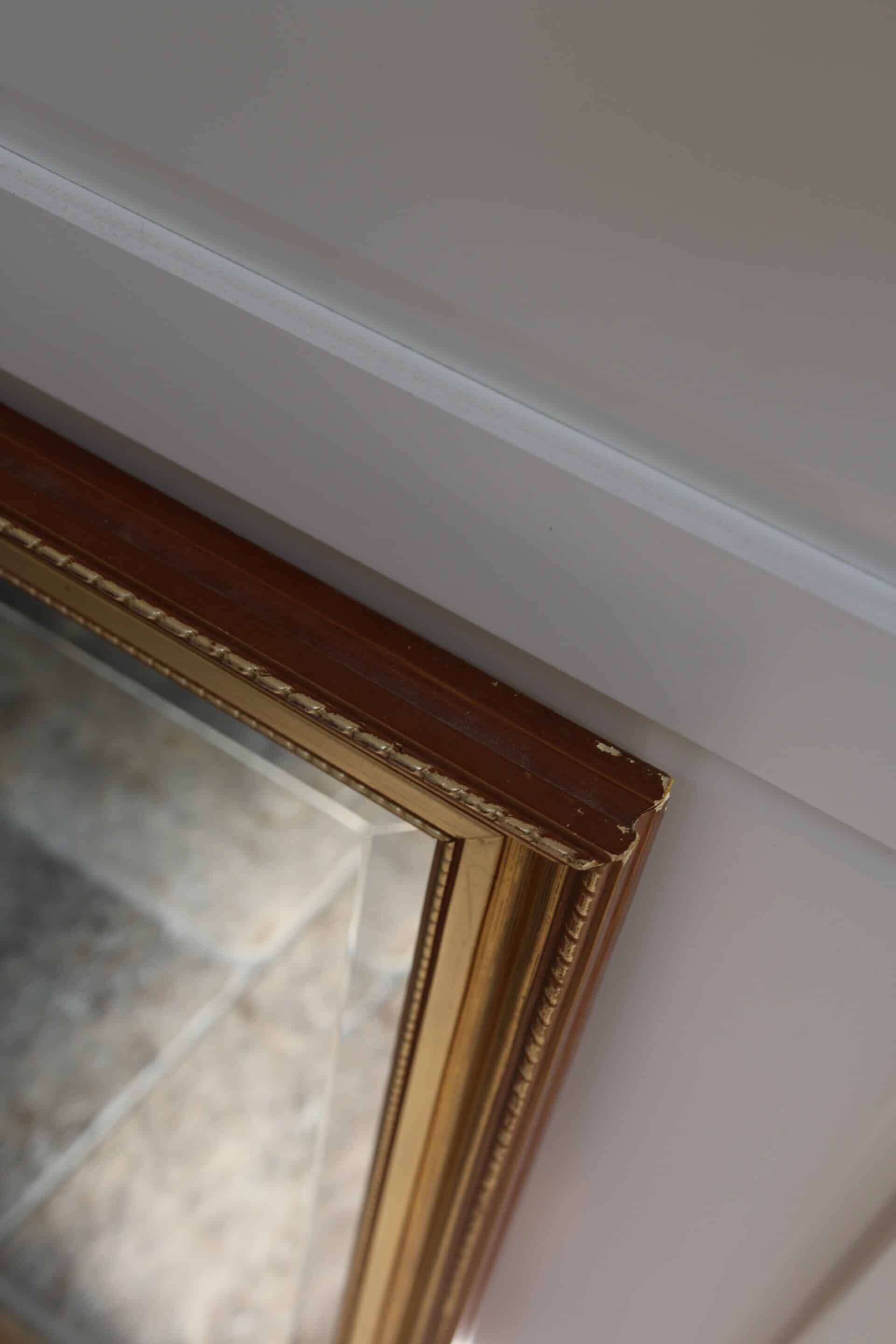 Large beveled mirror in carved wood