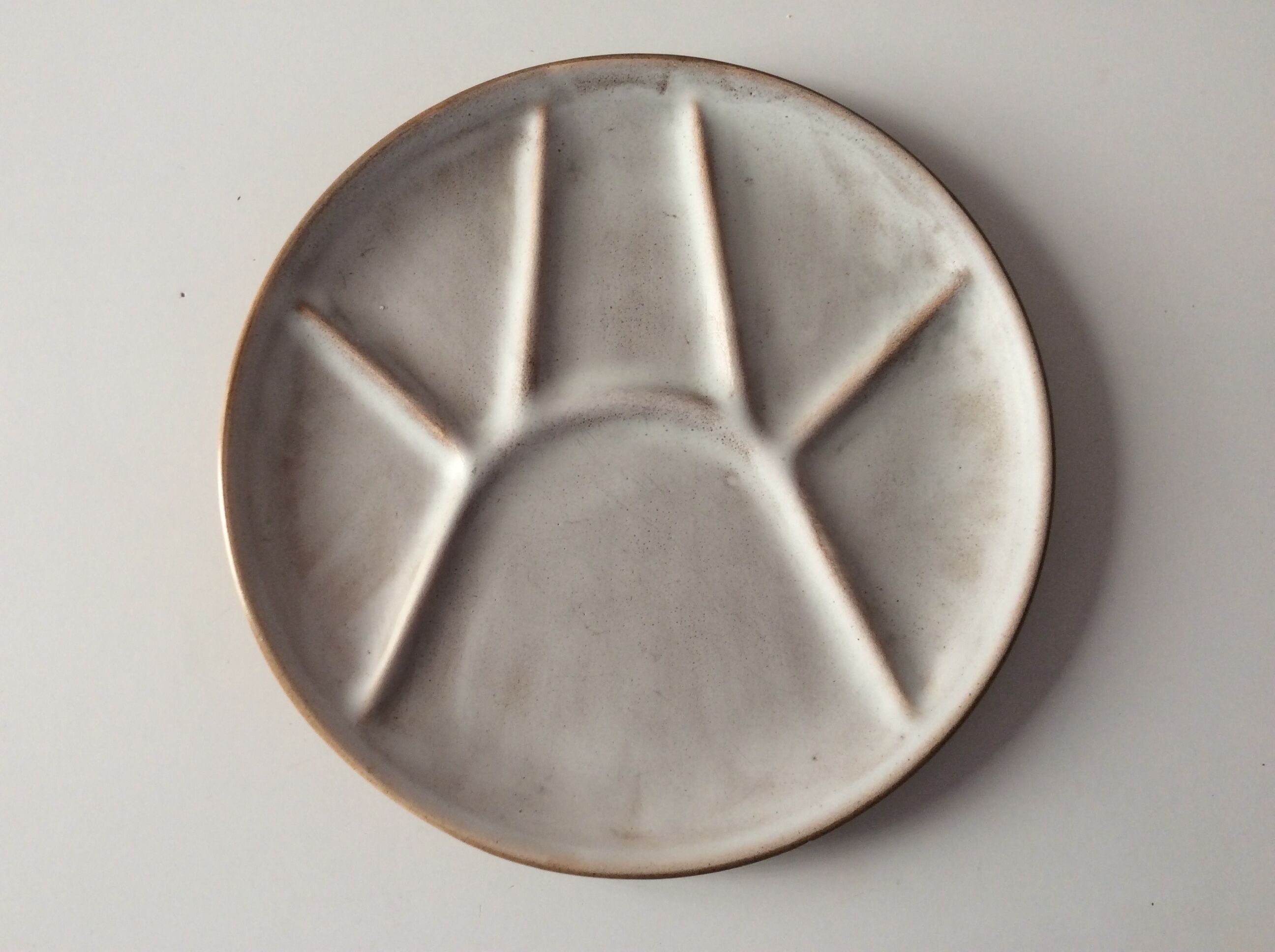 Series of 11 vintage sandstone plates with compartments