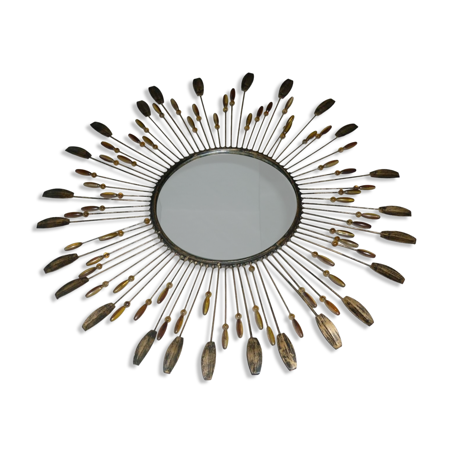 Round sun mirror with pearl rays and leaves