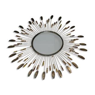 Round sun mirror with pearl rays and leaves