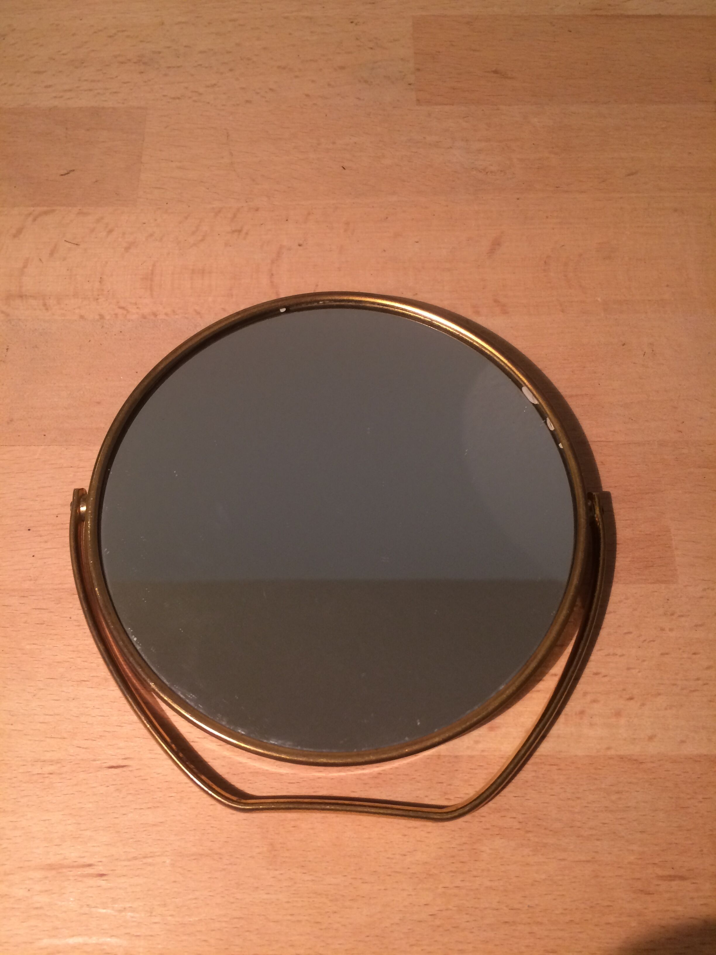 Vintage magnifiing gold round barber mirror