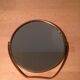 Vintage magnifiing gold round barber mirror