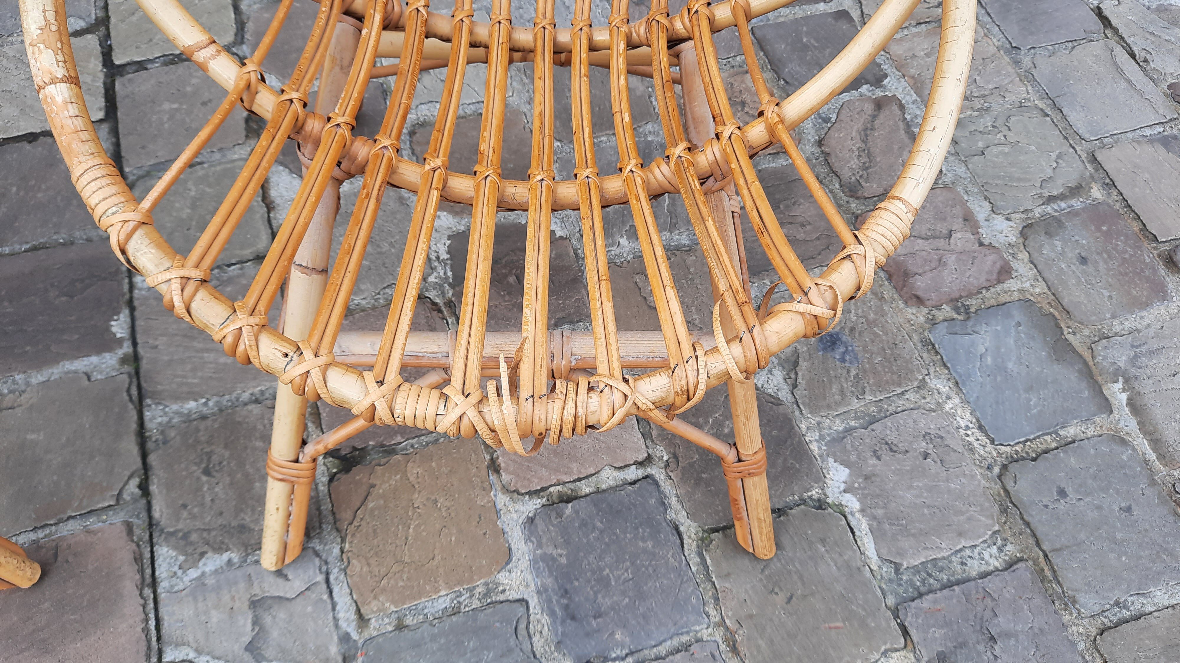 Pairs of shell rattan armchairs from the 50