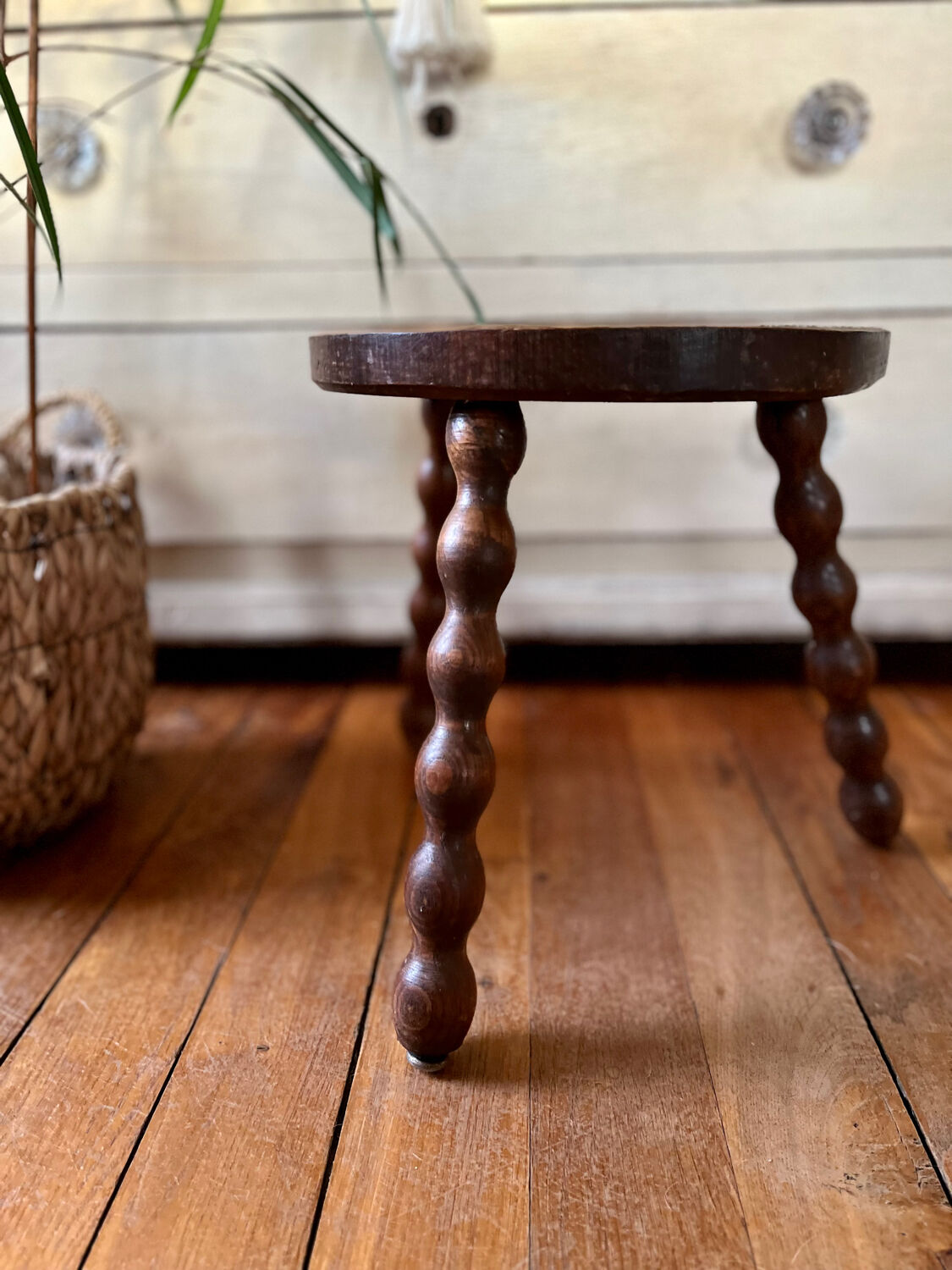 Low vintage wooden tripod stool