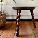 Low vintage wooden tripod stool