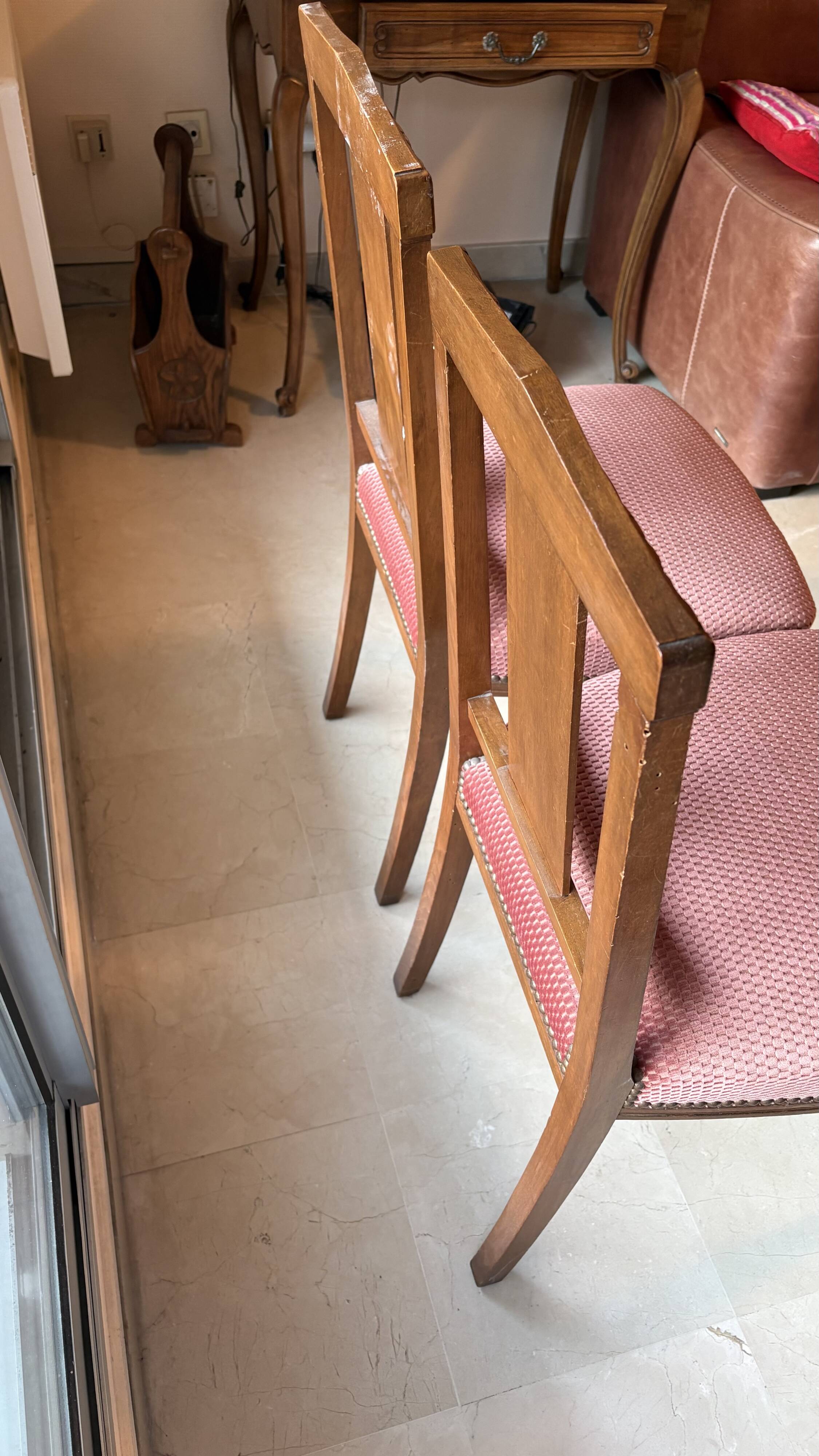 Set of 2 wooden chairs with padded seats.