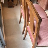 Set of 2 wooden chairs with padded seats.