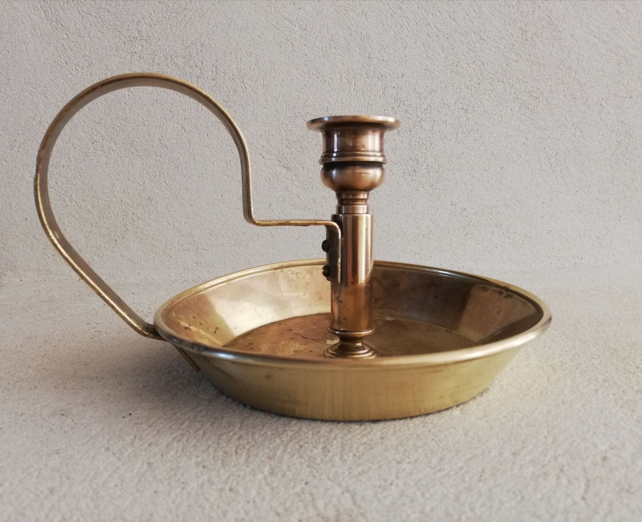 Brass hand candle holder