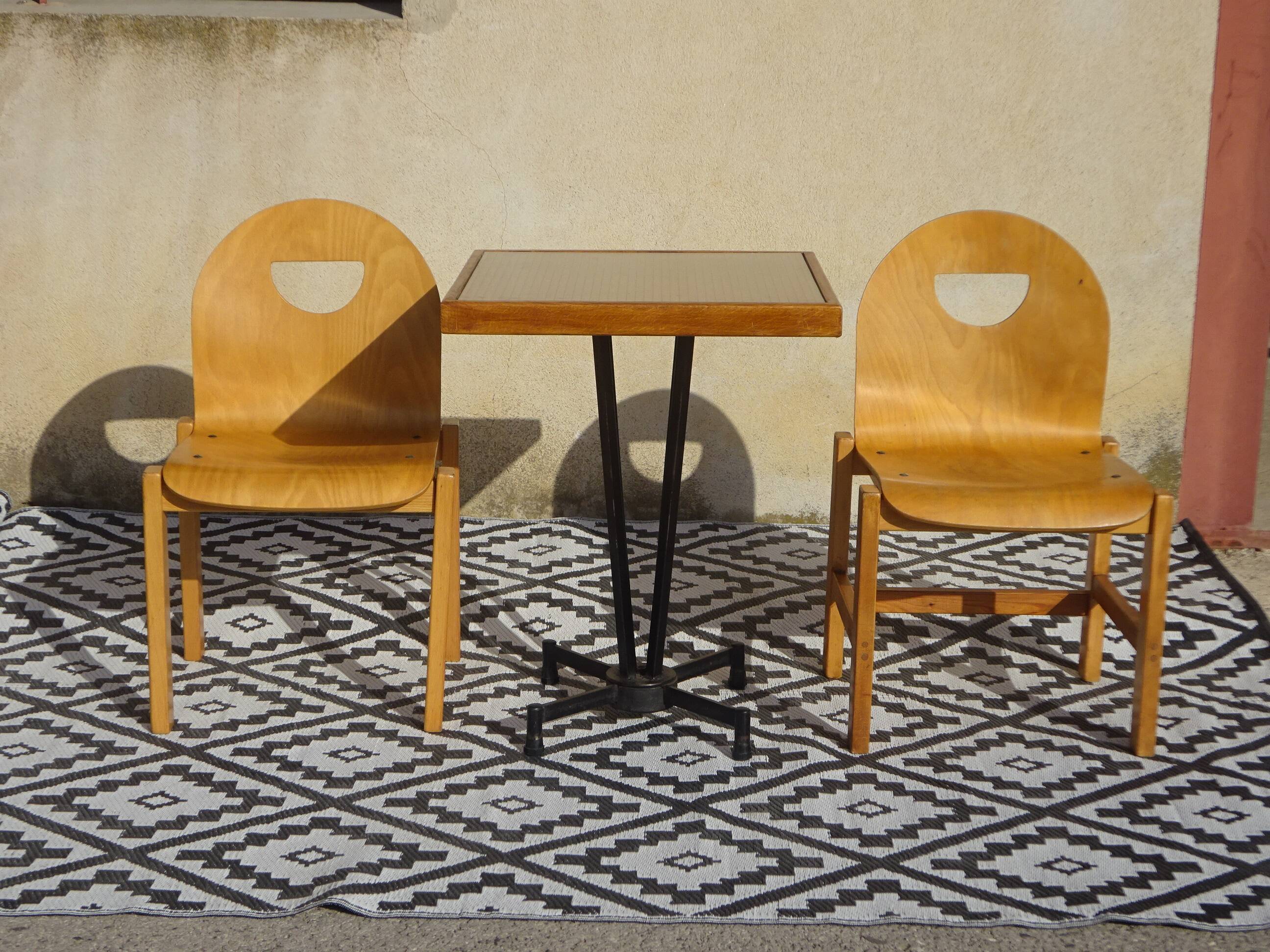 Pair of light wood chairs with post-formed seat and backrest.