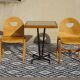 Pair of light wood chairs with post-formed seat and backrest.