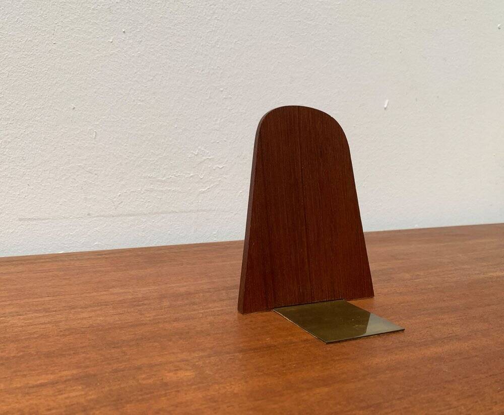 Mid-century Scandinavian bookends in teak and brass.