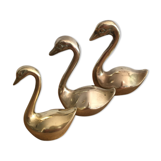 Trio of brass swans