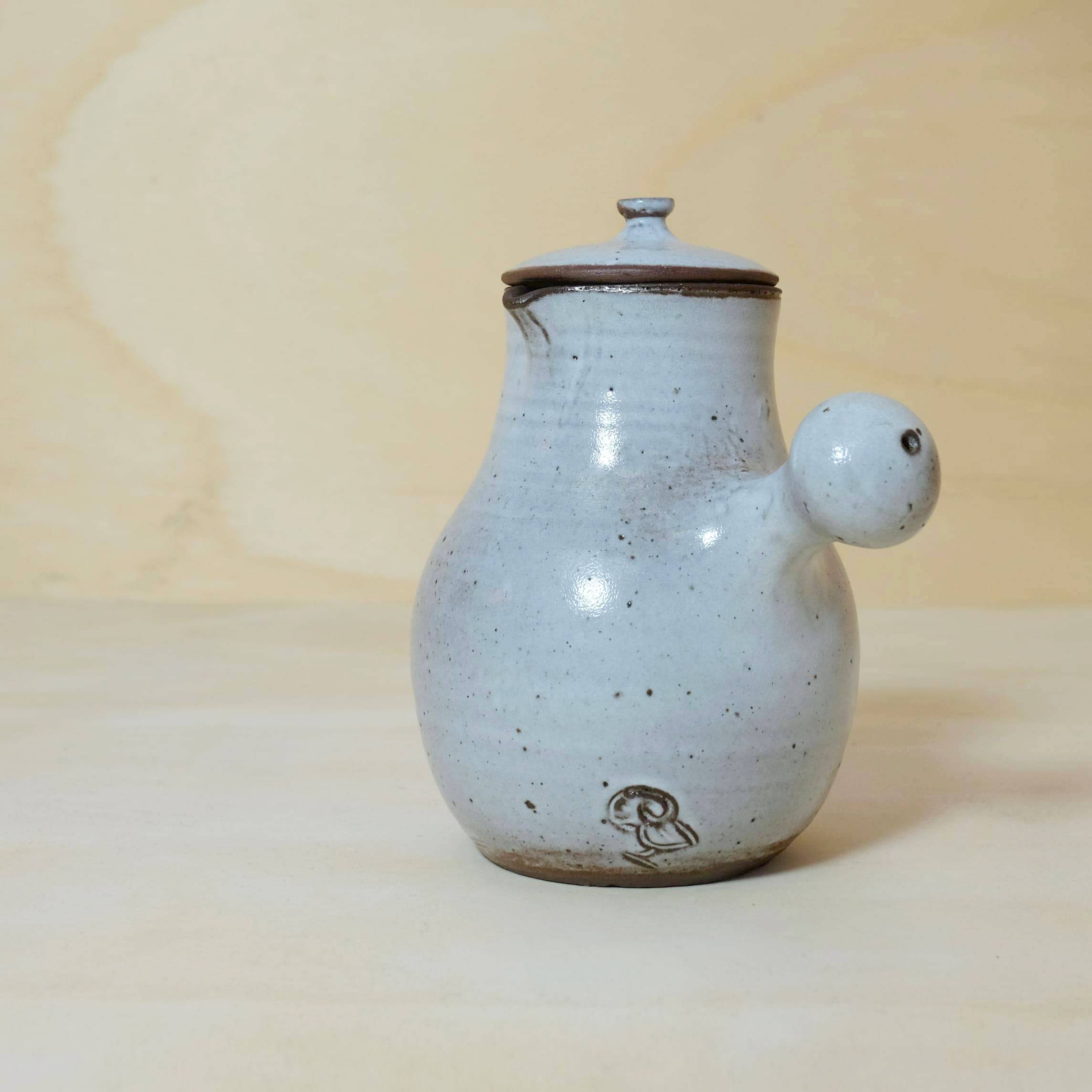 Jeanne and Norbert Pierlot, enamelled stoneware teapot and stopper, 26cm.