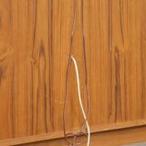 Elegant vintage Danish display cabinet with glass panels and atmospheric lighting