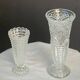 Set of two large, vintage, clear, molded glass vases on feet