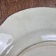 Old Gien plate with carved edges featuring doves and blue flowers, circa 1920-1930.