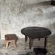 Antique round coffee table in Indonesian teak with turned legs.
