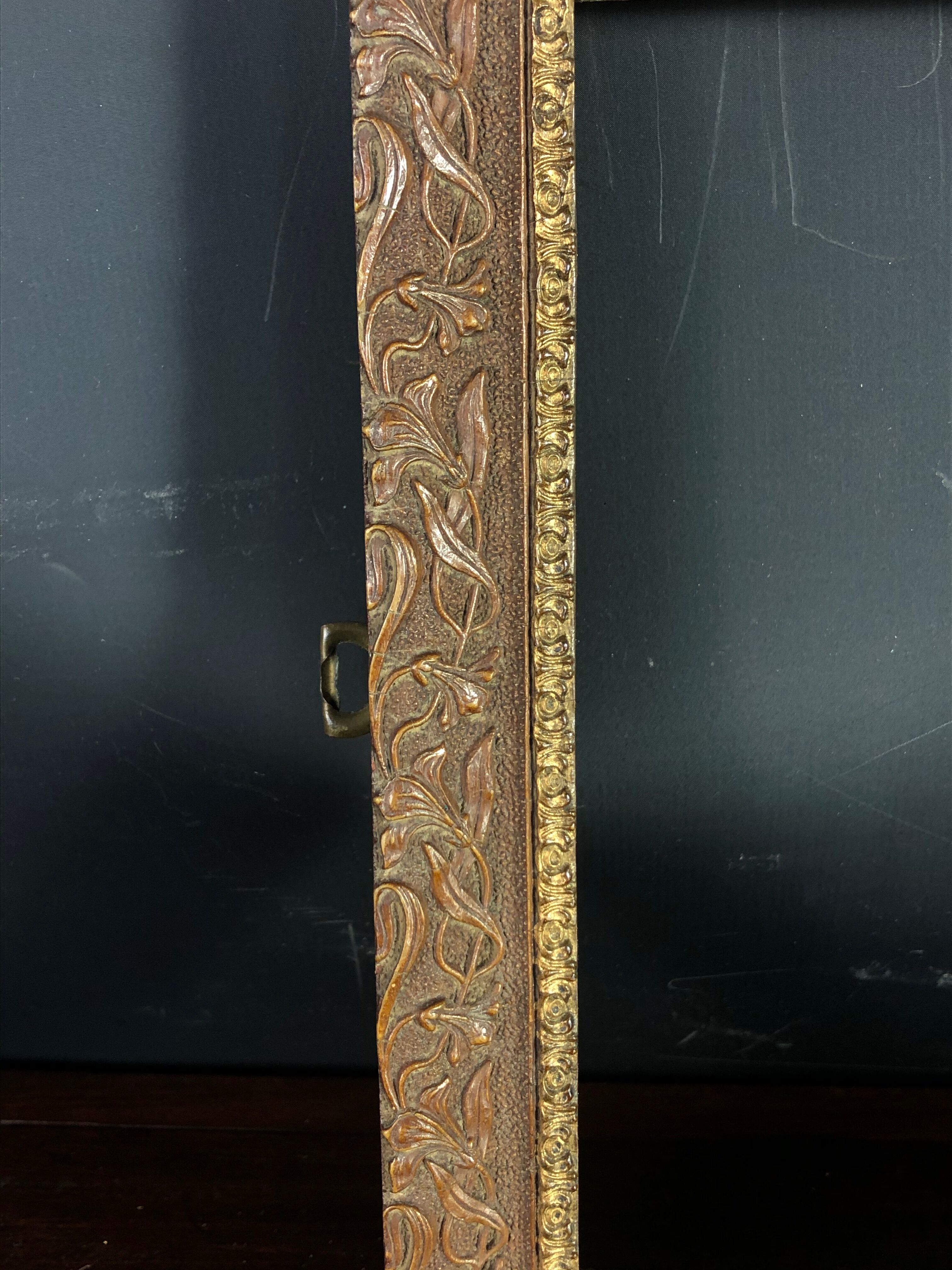 Old frame wood and stucco patinated and gilded