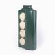 A tall ceramic vase glazed with dark green colour