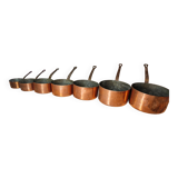 Set of 7 copper pans / brass handle