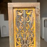 Rectangular Indonesian construction element with blue and yellow plant in carved wood