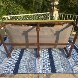 Richly carved solid wood bench in Louis XVI style.
