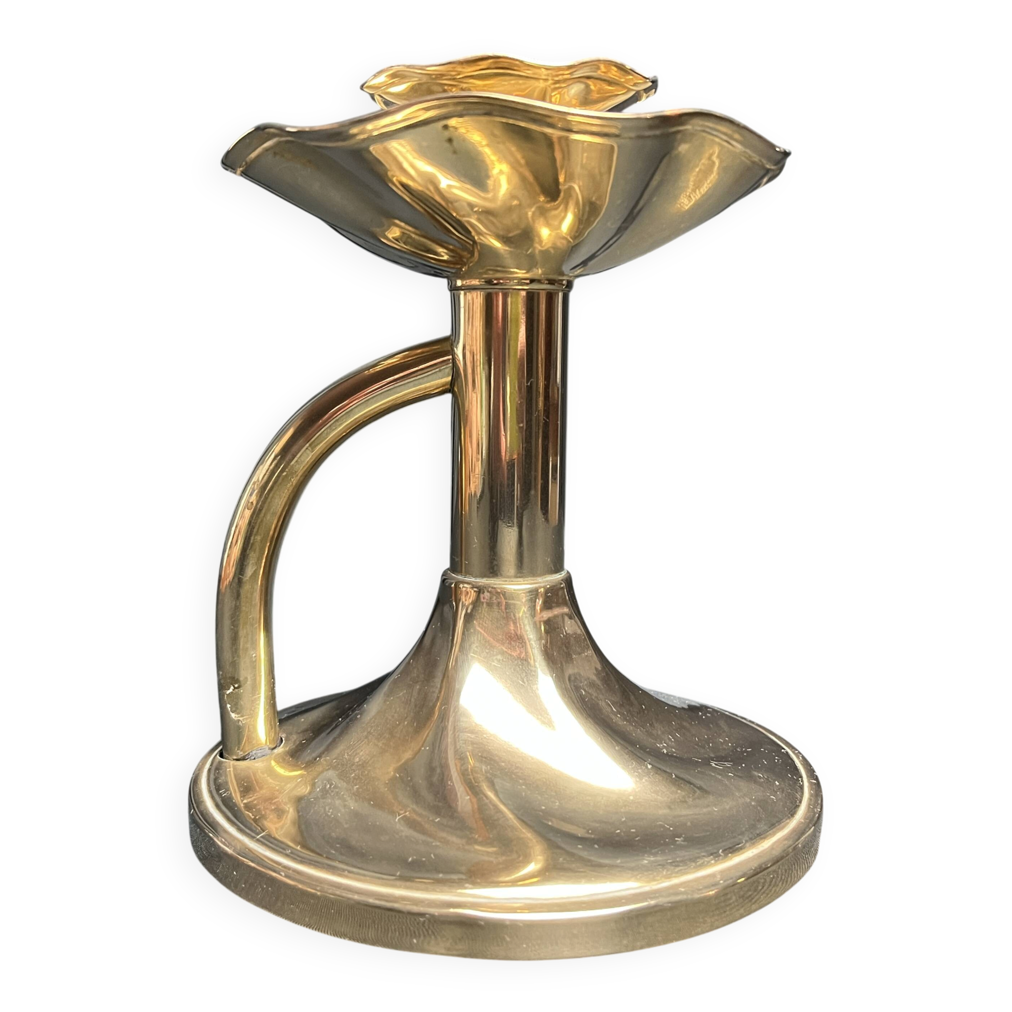 Brass candlestick in a fluted shape from the early 20th century.