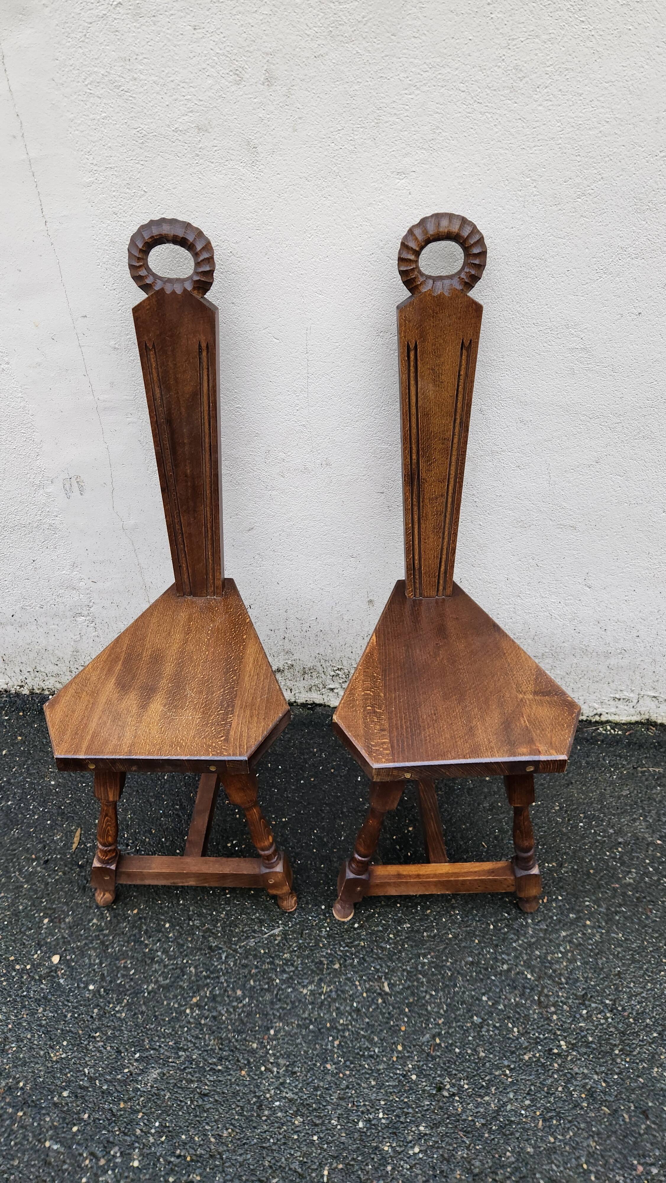 2 three-legged chairs made of solid wood