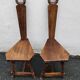 2 three-legged chairs made of solid wood