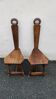 2 three-legged chairs made of solid wood