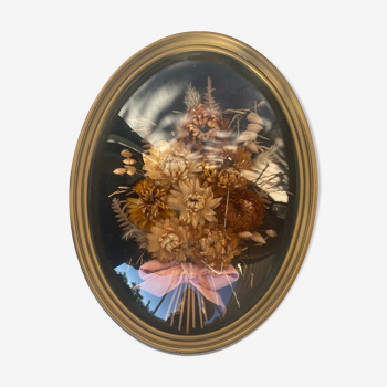 Frame bouquet of dried flowers in oval domed glass