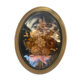 Frame bouquet of dried flowers in oval domed glass