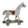 Wooden children's horse on wheels