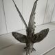 Silver metal rooster / Greenhouse book